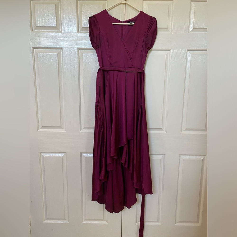 Gorgeous dark purple/pink dress!! Only worn once for prom. Wavy front slit.
